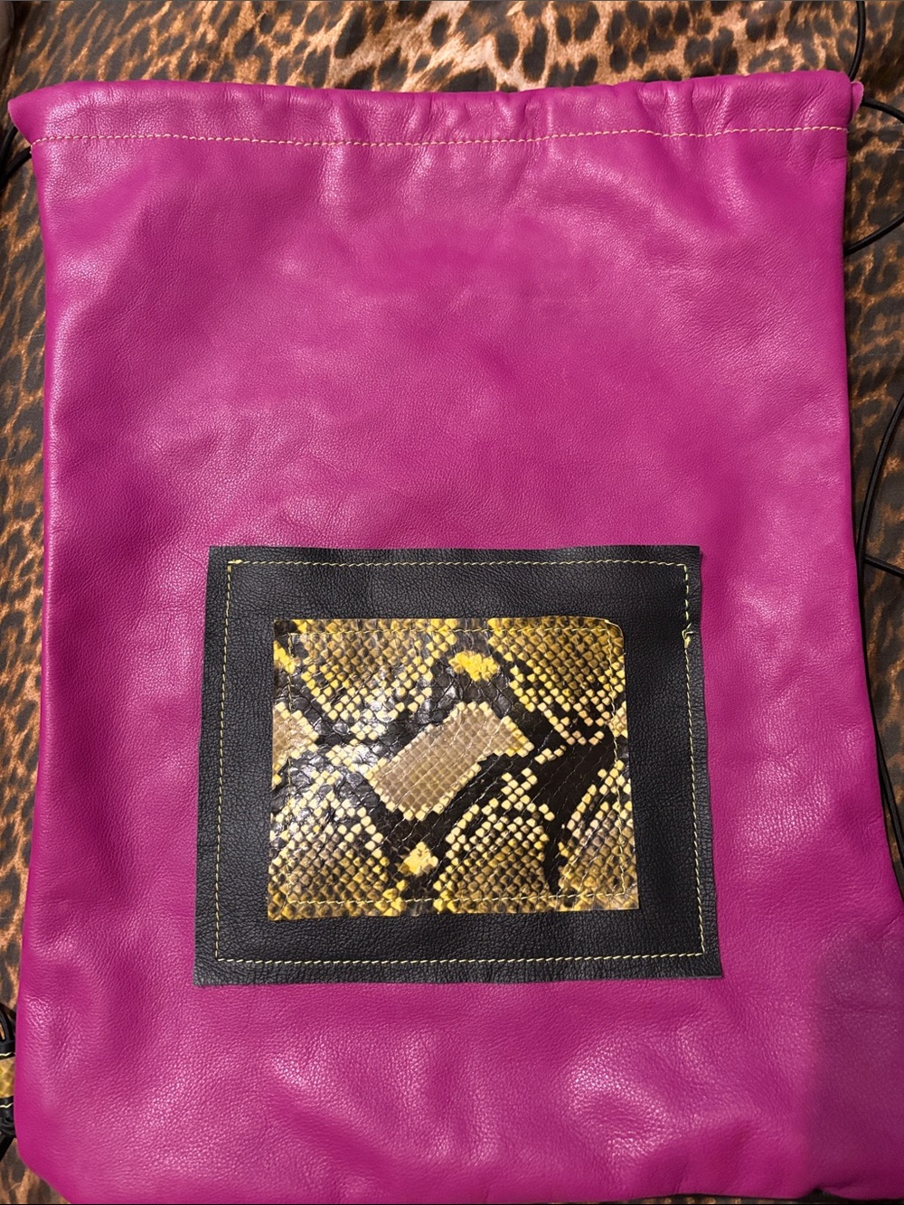 Women's Leather Fuchsia Drawstring Pouch with Snake-Print Accent